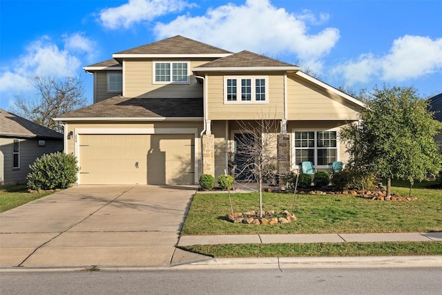 view of front of property with a garage and a front lawn