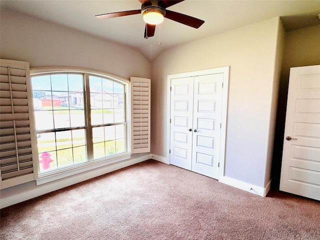 125 Millsaps Ct, Bastrop, TX 78602 - unfurnished bedroom featuring carpet flooring, baseboards, a closet, and a ceiling fan