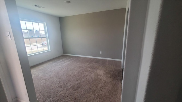 view of carpeted spare room