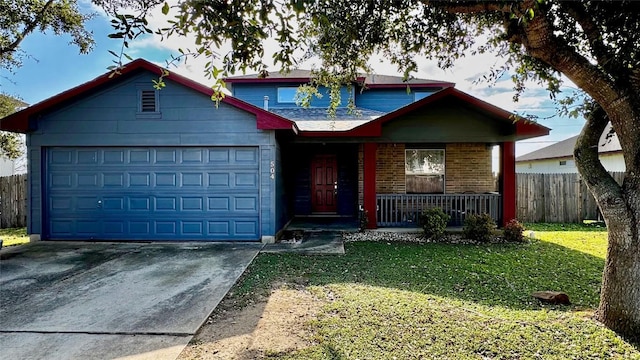 view of front of house featuring a front yard, a porch, and a garage