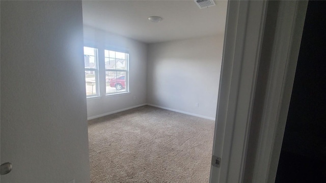 unfurnished room featuring carpet