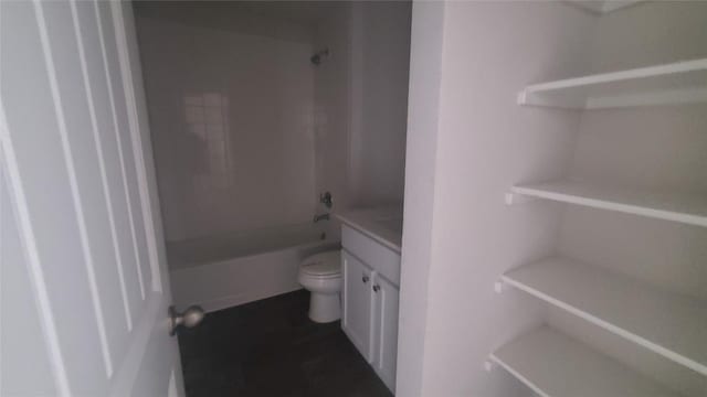 full bathroom with washtub / shower combination, vanity, and toilet