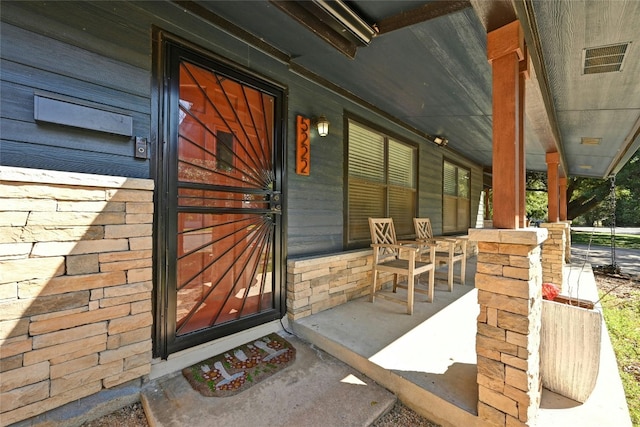 exterior space with visible vents and a porch