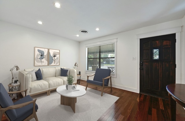 living area featuring dark wood-style floors, visible vents, recessed lighting, and baseboards