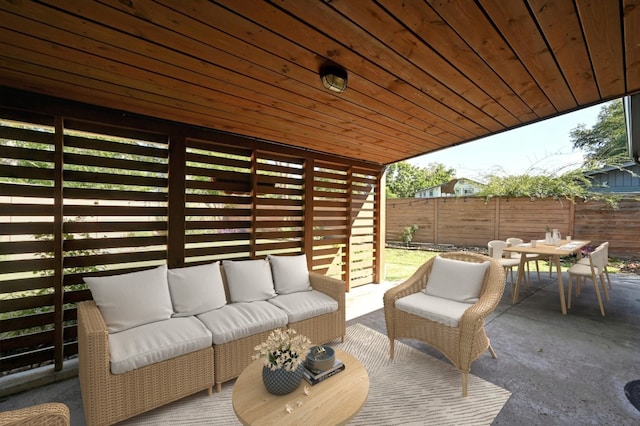 view of patio / terrace with an outdoor living space, outdoor dining area, and a fenced backyard