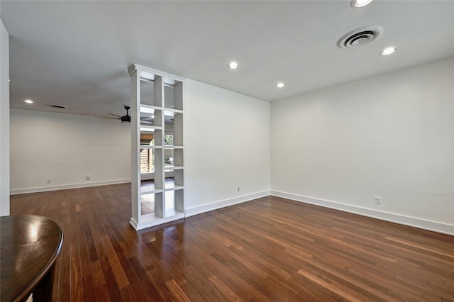 unfurnished room featuring recessed lighting, visible vents, baseboards, and wood finished floors