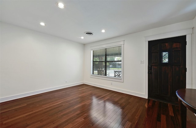 entryway featuring dark wood-type flooring, recessed lighting, baseboards, and visible vents