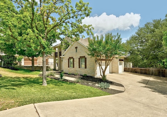 view of front of home featuring a garage and a front lawn