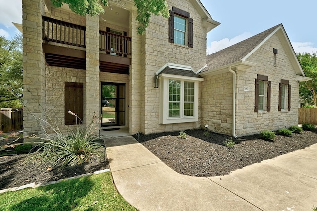 property entrance with a balcony