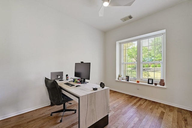 office with hardwood / wood-style floors and ceiling fan