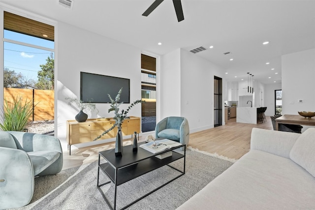 1407 Valleyridge Dr Unit A, Austin, TX 78704 - living room featuring visible vents, light wood-style floors, ceiling fan, and recessed lighting