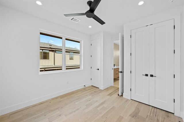 unfurnished bedroom with a closet, ceiling fan, and light hardwood / wood-style flooring