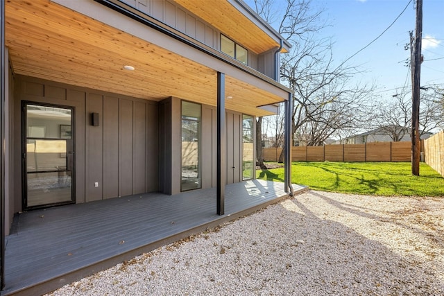 deck with a yard and a patio