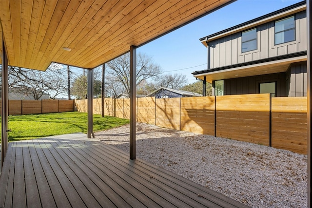 wooden deck with a lawn