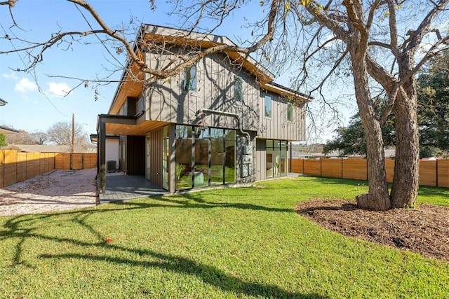 1407 Valleyridge Dr Unit A, Austin, TX 78704 - rear view of property featuring a fenced backyard, a yard, and a patio area