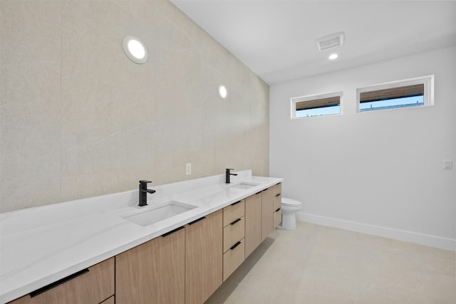 1407 Valleyridge Dr Unit A, Austin, TX 78704 - full bathroom with visible vents, a sink, toilet, and double vanity