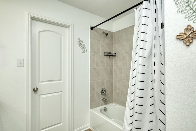 bathroom with shower / bath combo with shower curtain