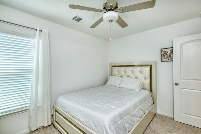 carpeted bedroom with ceiling fan