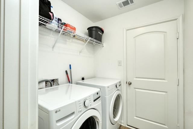 washroom featuring independent washer and dryer