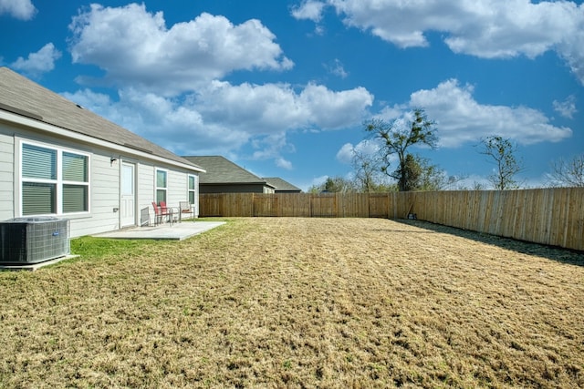 view of yard featuring a patio area and cooling unit