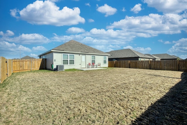 back of property with central air condition unit and a patio