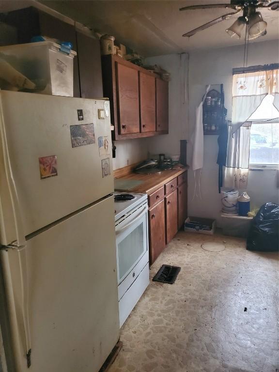 kitchen with ceiling fan and white appliances