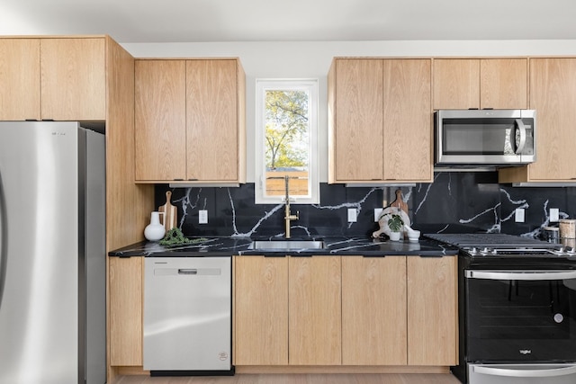 kitchen featuring backsplash, stainless steel appliances, and light brown cabinets