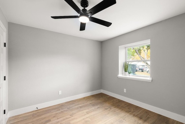 unfurnished room with light wood-type flooring and ceiling fan