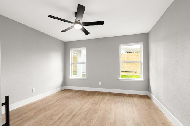 unfurnished room with ceiling fan and light hardwood / wood-style floors