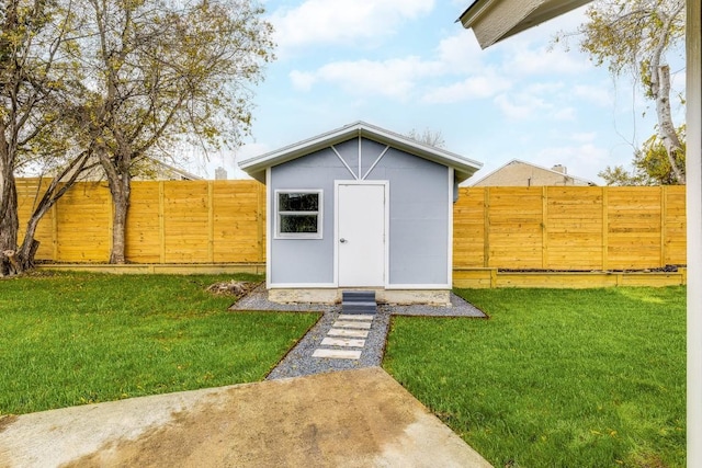 view of outbuilding featuring a yard