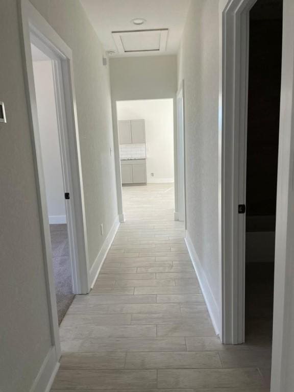 corridor featuring light wood-type flooring