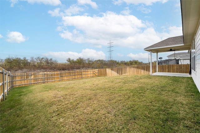 view of yard with ceiling fan