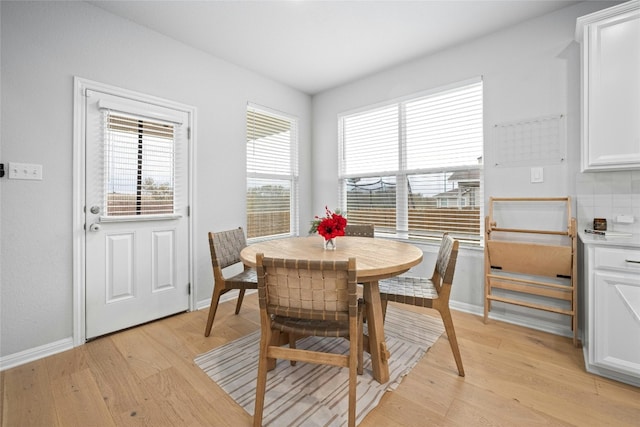 dining room with light hardwood / wood-style flooring