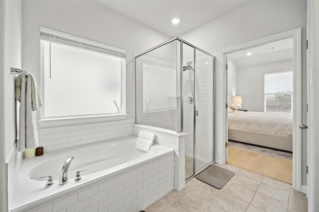 bathroom with tile patterned floors and separate shower and tub