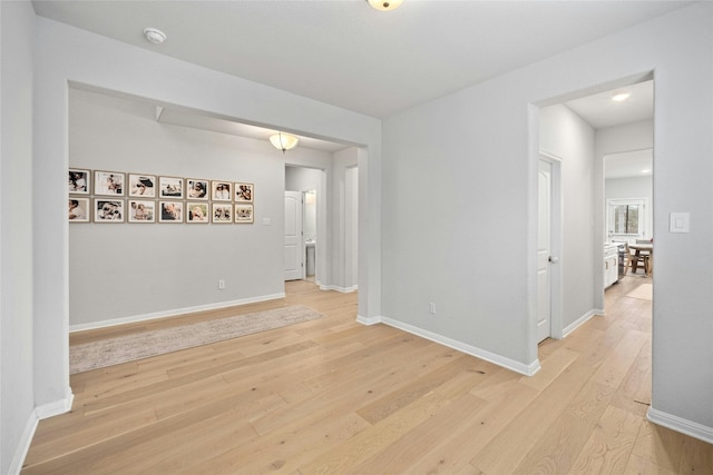 unfurnished room with light hardwood / wood-style floors