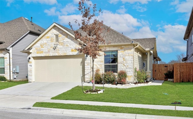 view of front facade featuring a garage and a front lawn