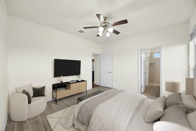 bedroom with ceiling fan and connected bathroom