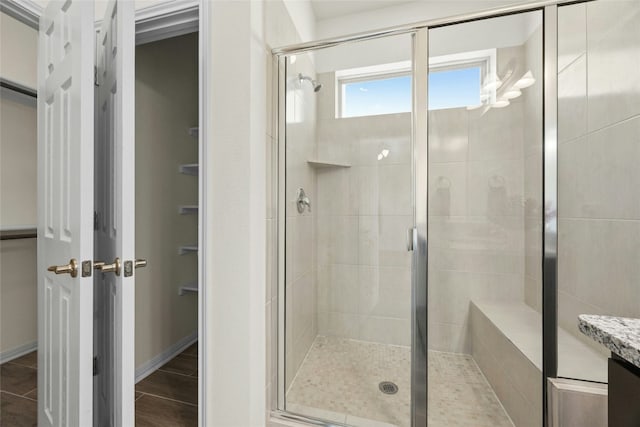 bathroom featuring vanity and an enclosed shower