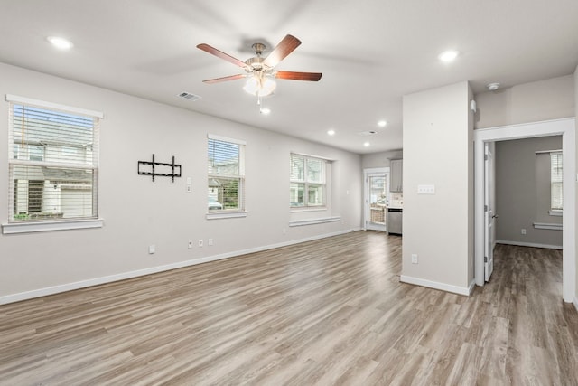 unfurnished living room with light hardwood / wood-style floors and ceiling fan