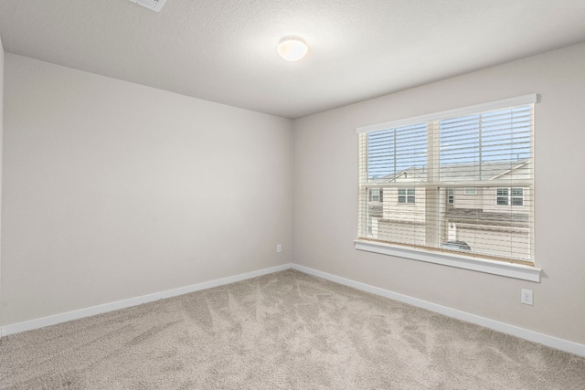 empty room featuring light colored carpet