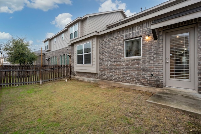 back of house featuring a yard