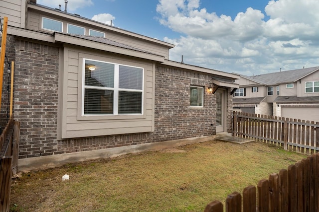 view of property exterior with a lawn