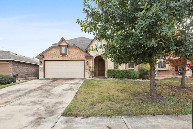 view of front of property featuring a front lawn and a garage