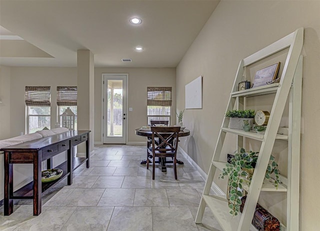 foyer entrance with light tile patterned flooring