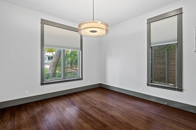 unfurnished room featuring dark hardwood / wood-style floors