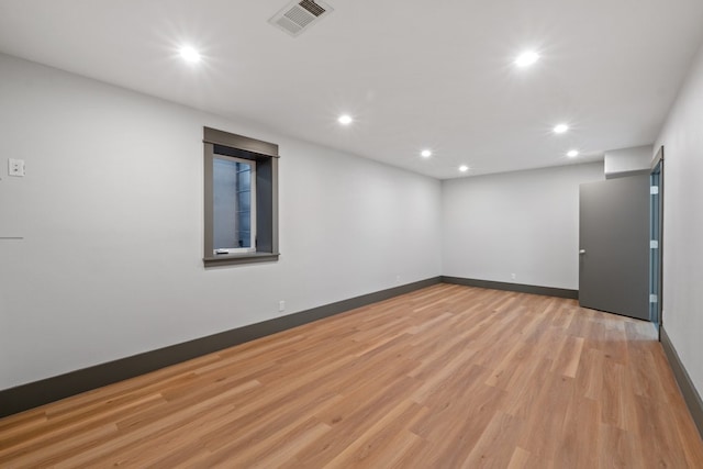 spare room featuring light wood-type flooring