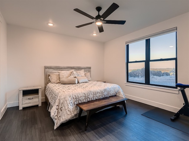 bedroom featuring dark hardwood / wood-style floors and ceiling fan