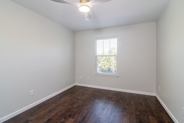 empty room featuring ceiling fan and dark wood-type flooring