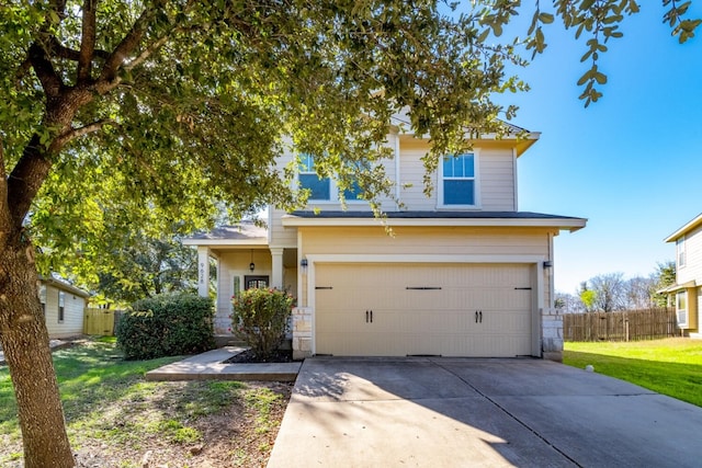 view of front of house featuring a front lawn and a garage