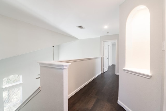 corridor featuring dark hardwood / wood-style flooring